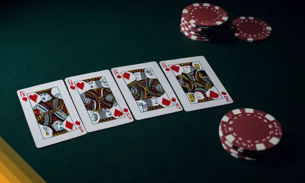 Four kings laid in a row next to red chips for the 32 Card race